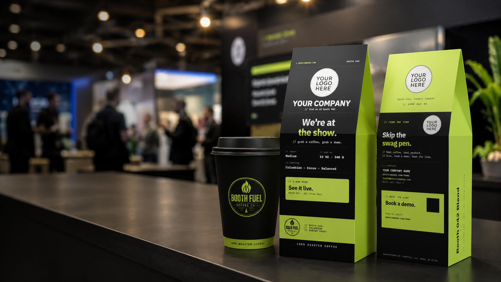 Custom coffee packaging mockup on a dark countertop, featuring a black and neon yellow-green coffee cup, a matching coffee bag, and a coffee box with placeholder branding and event text, set against a blurred convention background.