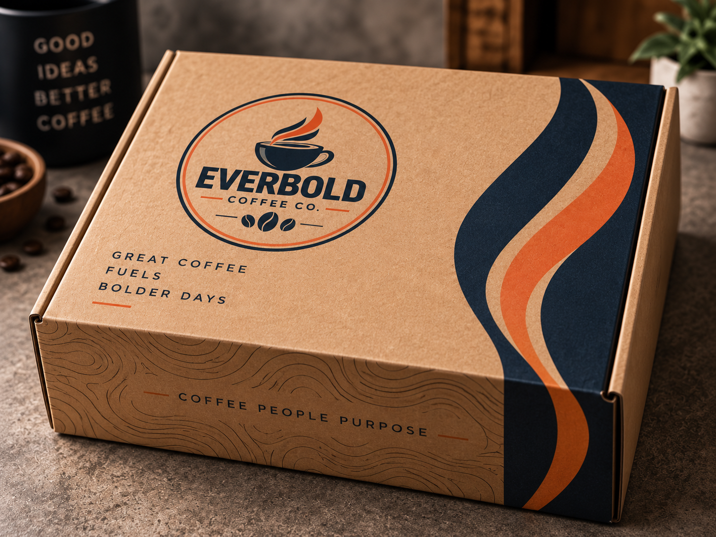 A kraft cardboard coffee subscription box from Everbold Coffee Co. with a printed logo and wavy navy, cream, and orange graphic accents on the side, photographed on a countertop with coffee beans and a mug in the background.