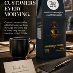 A branded coffee gift bag labeled 'Renaissance Roast' stands on a dark wooden table beside a black coffee mug, a thank-you card, a pen, and a notebook in a styled office setting. Large promotional text appears on the left, and the bag includes placeholder branding areas such as 'Your Logo Here' and 'Custom message or event/campaign'.