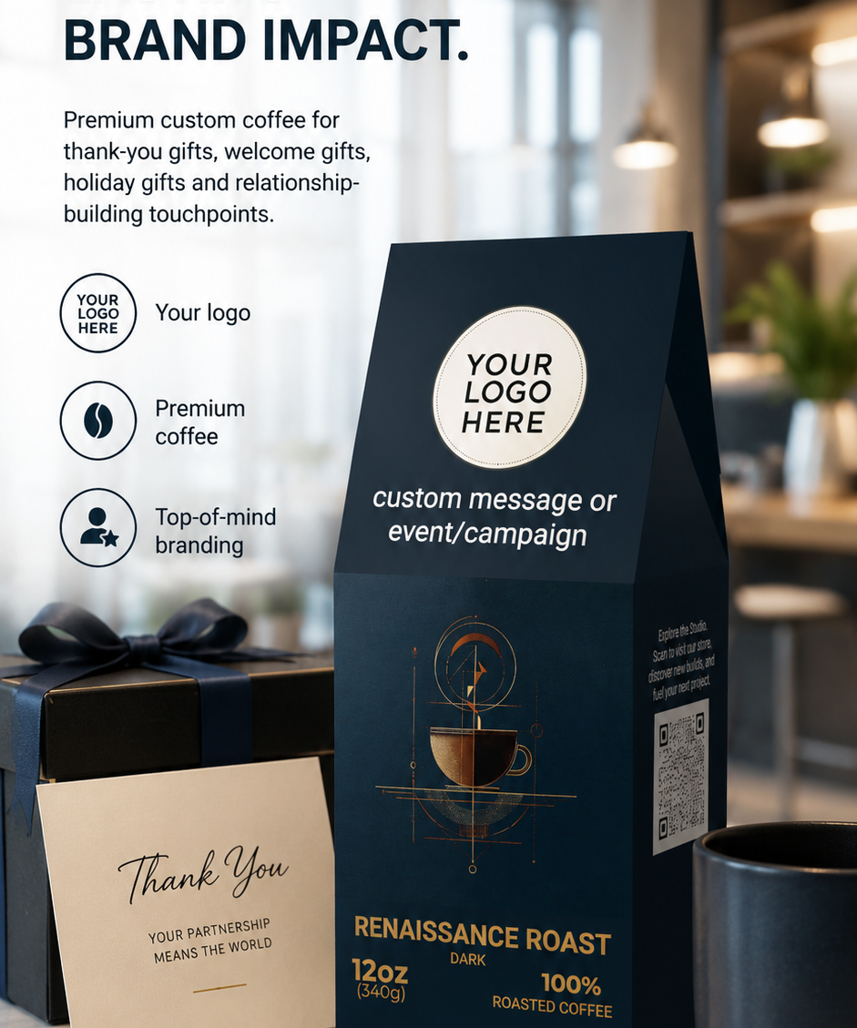A premium coffee gift bag in dark navy blue stands on a marble countertop, with a matching dark gift box and a thank-you card beside it. The bag has placeholder branding text and a coffee cup illustration.
