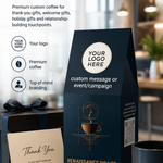 A premium coffee gift bag in dark navy blue stands on a marble countertop, with a matching dark gift box and a thank-you card beside it. The bag has placeholder branding text and a coffee cup illustration.