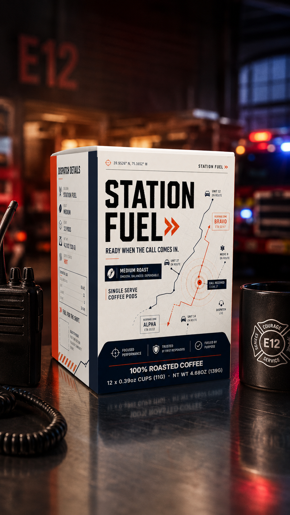 Station Fuel coffee pods box displayed on a reflective dark counter in a dimly lit emergency services themed environment, flanked by a black walkie-talkie and a black mug with an E12 emblem.